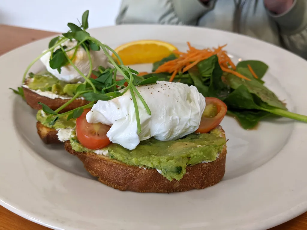 Poached egg on avocado toast with chilli oil